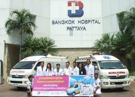 Ambulances and EMTs stand at the ready for any accident that might occur.